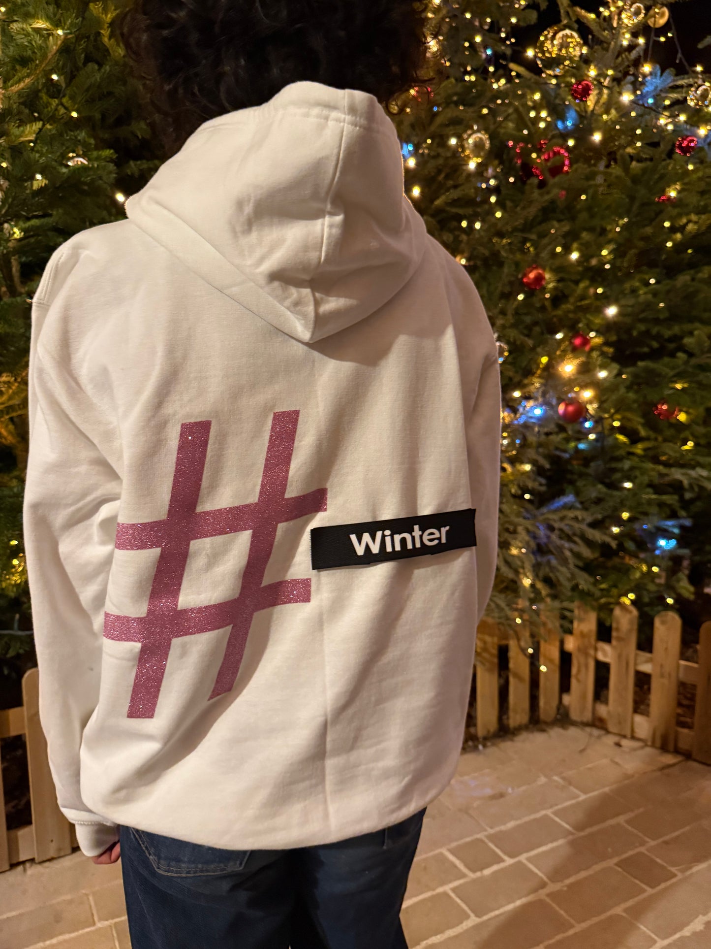 Pull blanc et rose pailleté